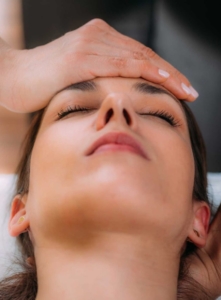 Craniosacral therapy CST hands on forehead