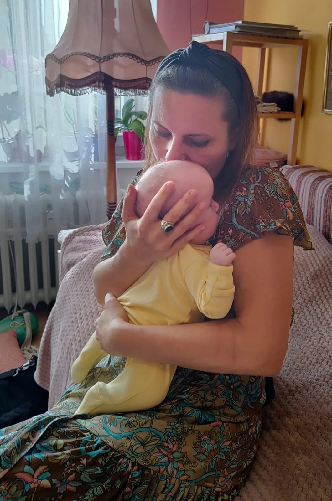 Lenka Lorien applying craniosacral therapy to the baby