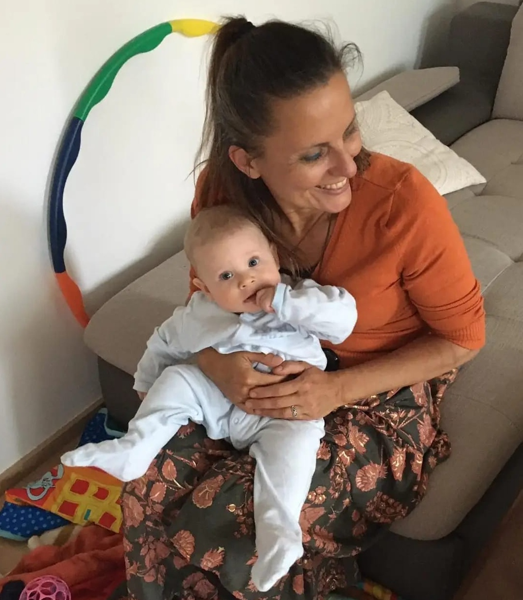 Lenka Lorien applying craniosacral therapy to the baby